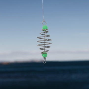 Carp fishing equipment setup with bait holder and feeder