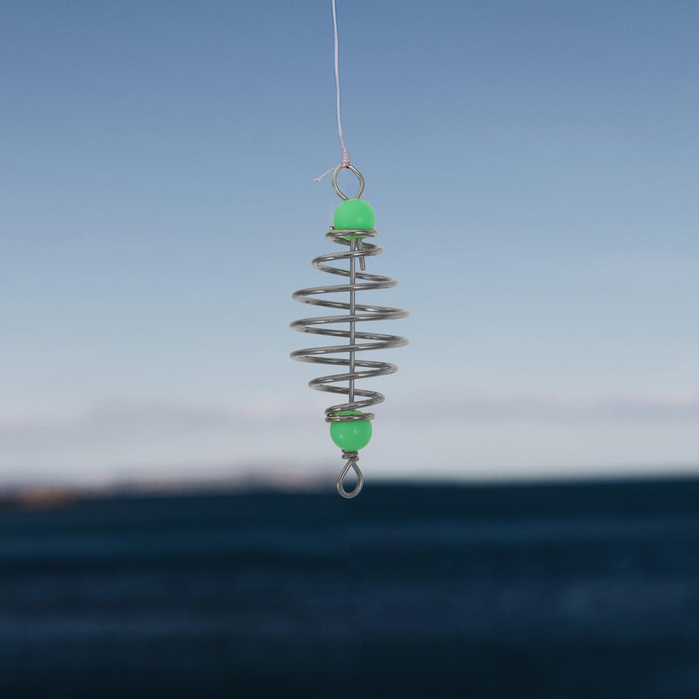 Carp fishing equipment setup with bait holder and feeder