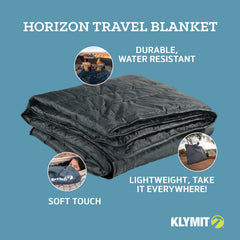 Klymit Horizon Travel Blanket with four corner stakes for stability on grass
