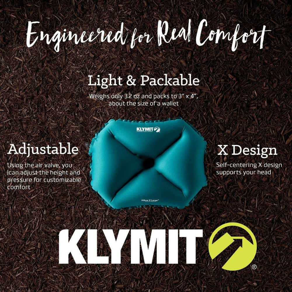 Klymit Pillow X teal deflated, compact packable design fits easily.