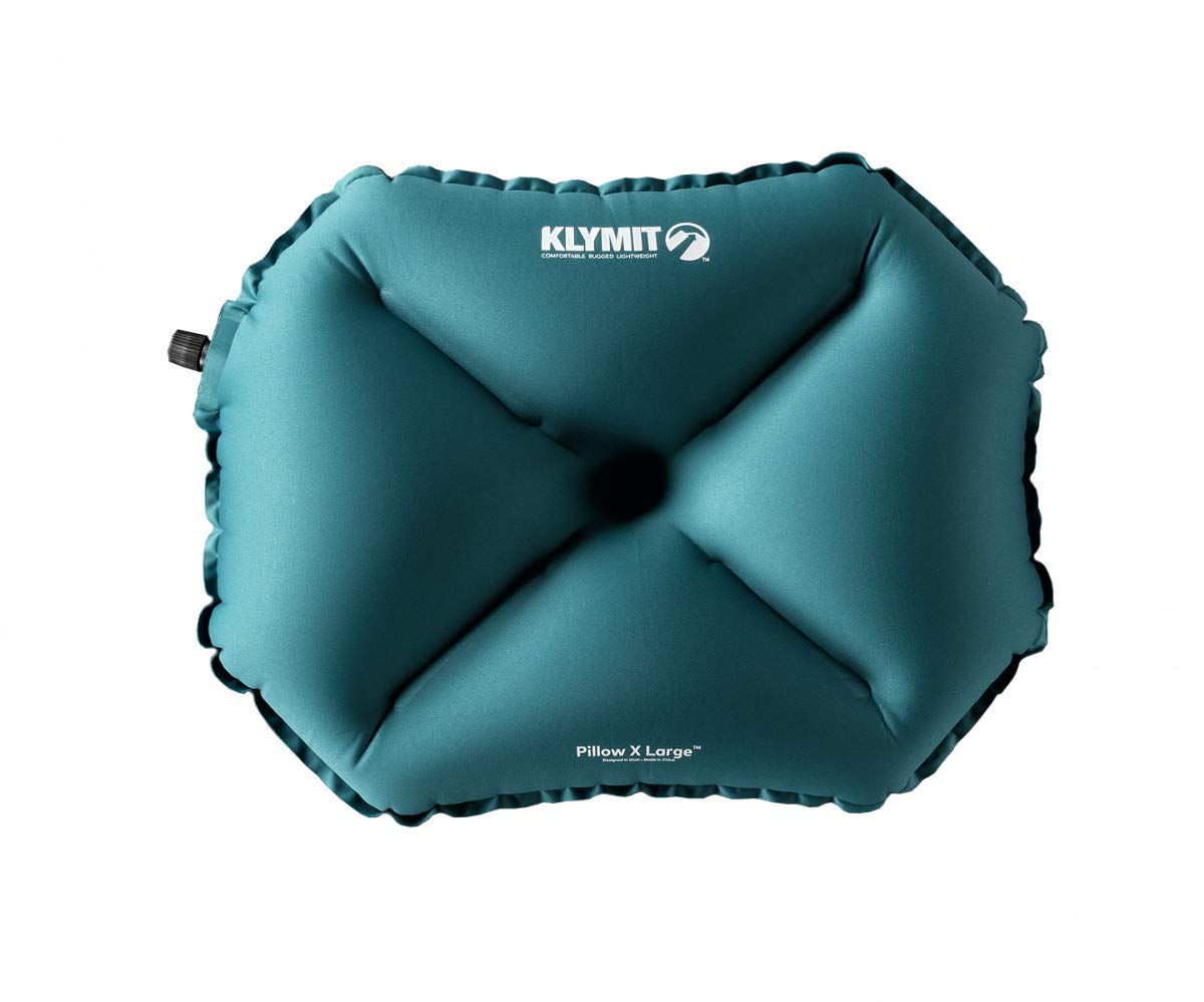 Klymit Pillow X teal inflated for travel providing supportive, cradled head comfort.