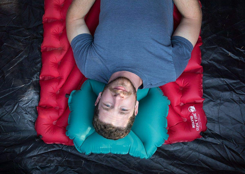 Klymit Pillow X teal self-centering design supports stable sleep.