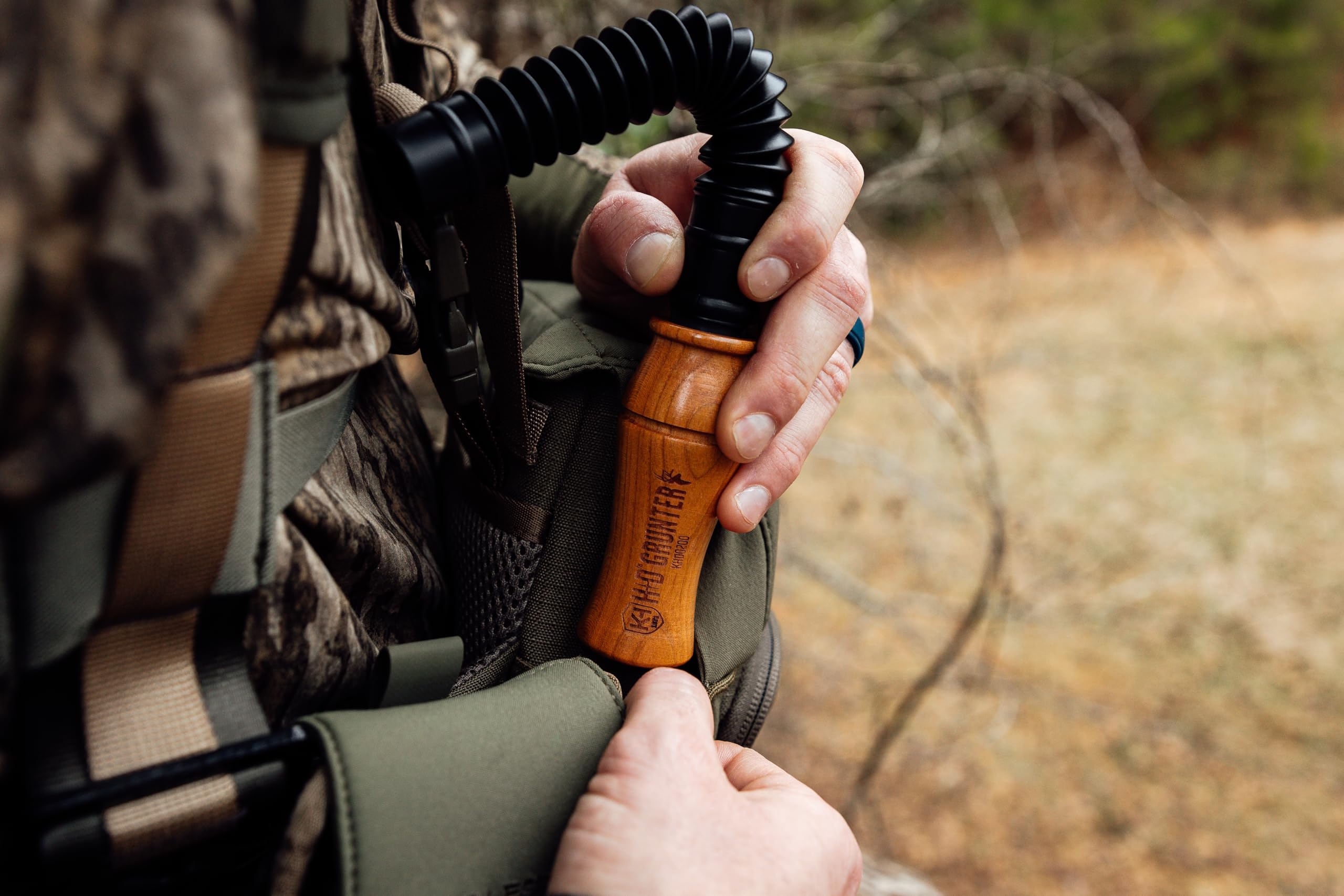 User demonstrates lip placement on the wood end of the HD Grunter.