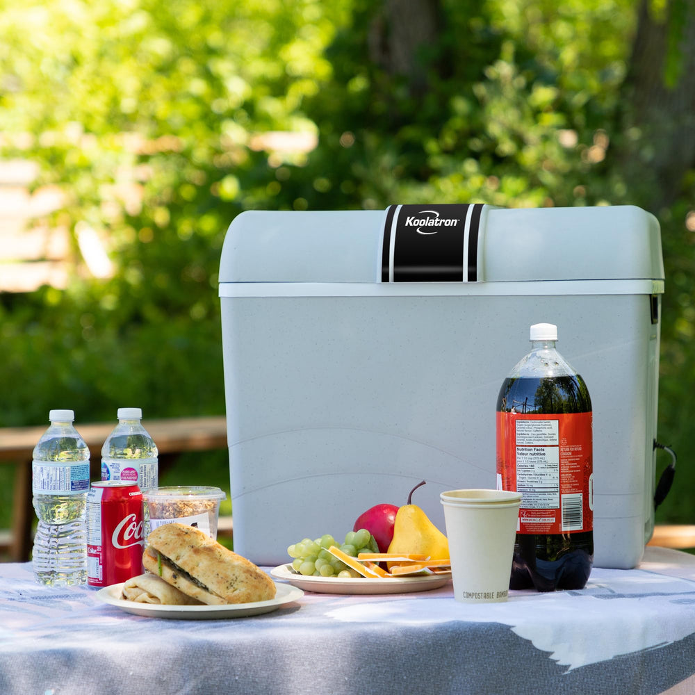 Koolatron 12V iceless cooler open lid showcasing spacious interior for drinks and snacks