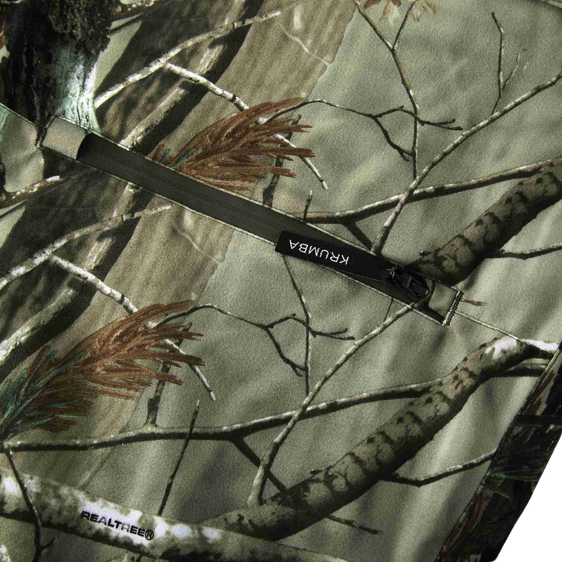 Krumba camo pattern pants blending into woodland environments