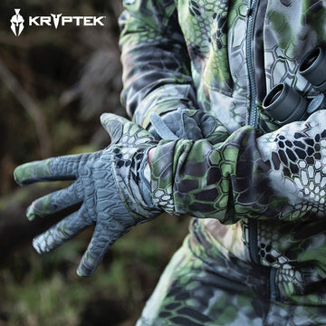 Field-ready Kryptek Tora Glove shown in outdoor hunting scenario.