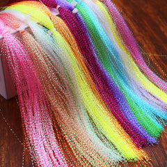 Close-up of pearl Krystal Flash strand for fly tying
