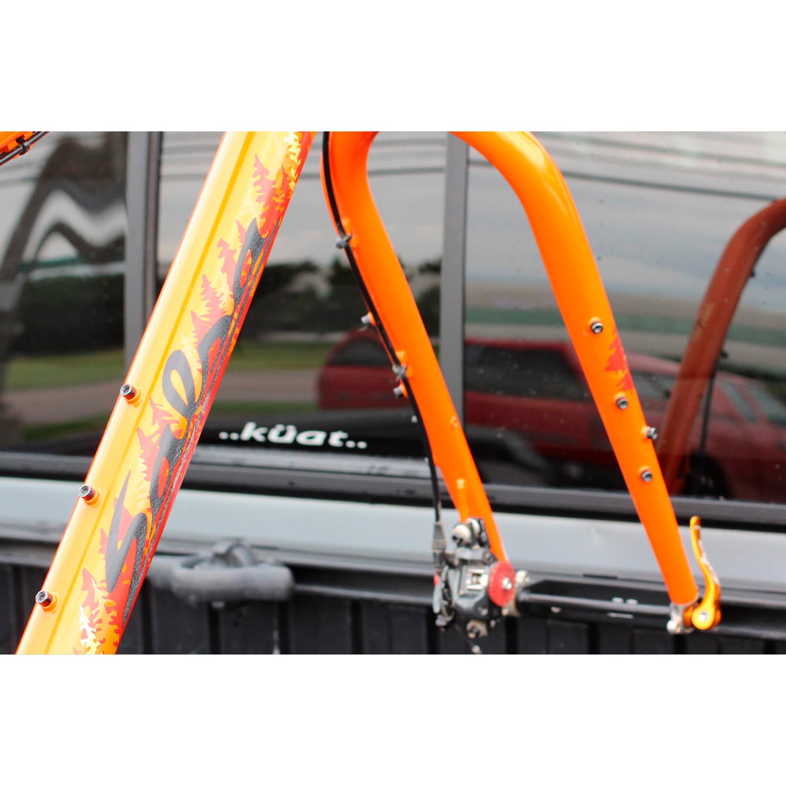 KUAT Dirtbag Phat-skewer bolt-on in action for secure transport.