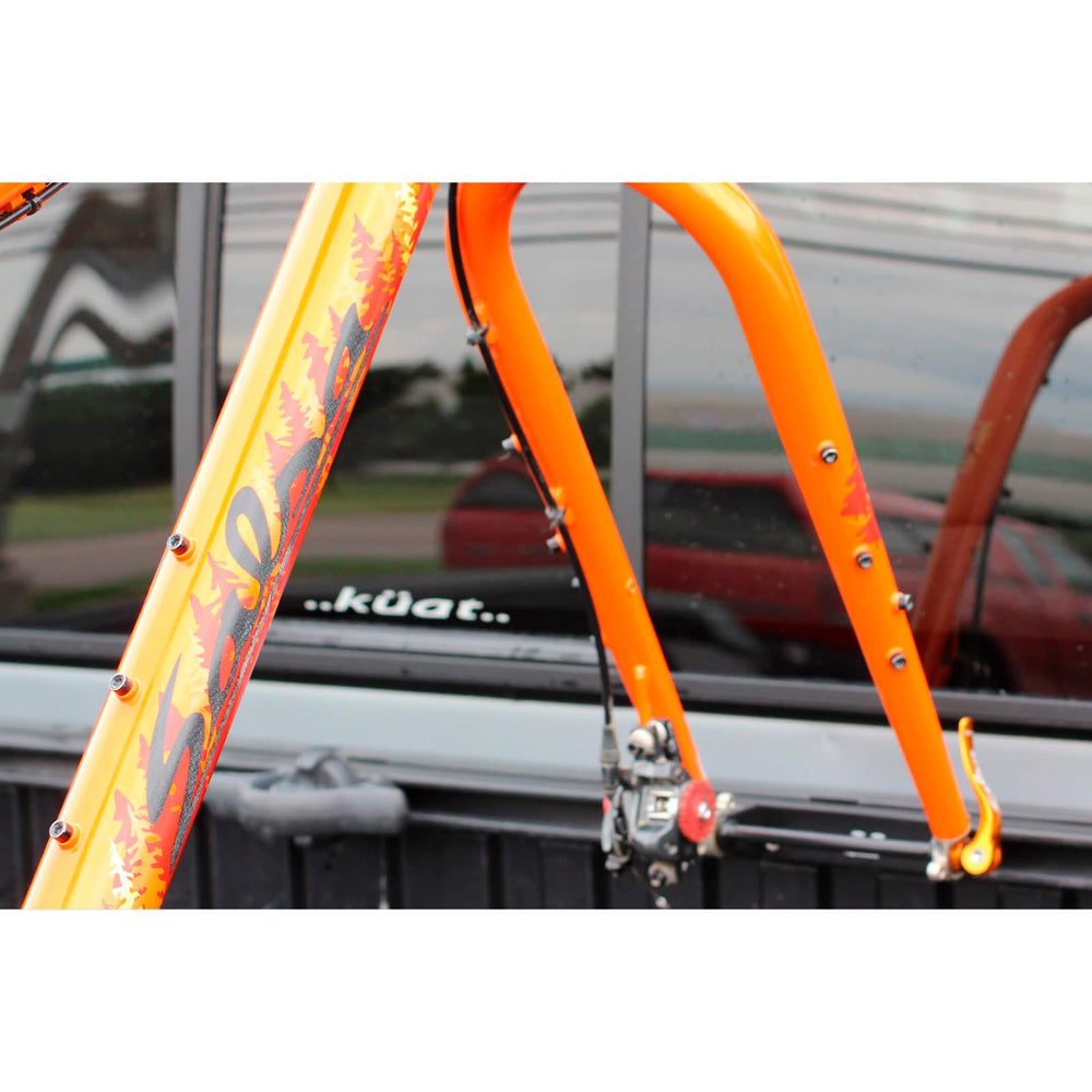 KUAT Dirtbag Phat-skewer bolt-on in action for secure transport.