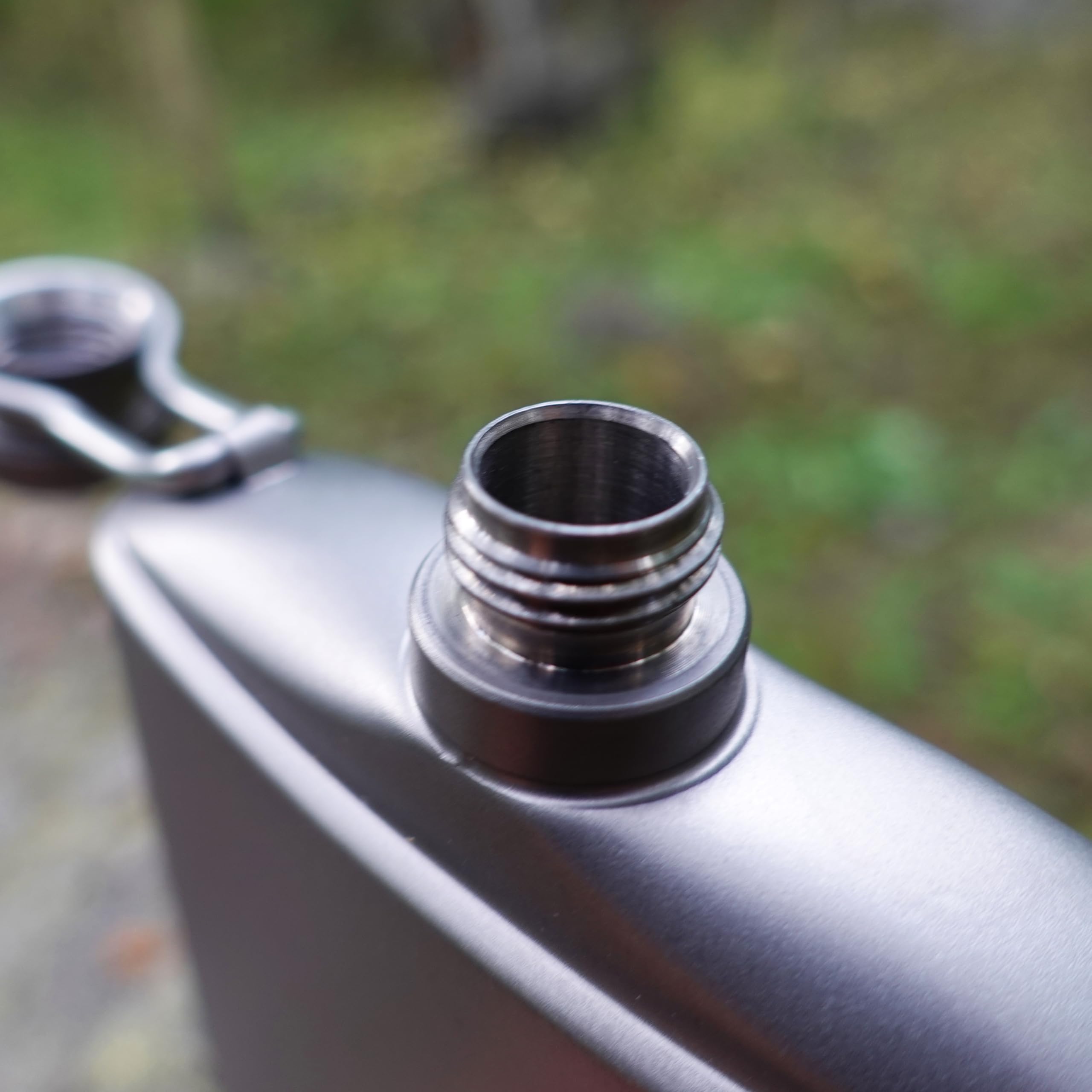 Kuvik titanium flask in backpack usage image conveys easy access on trails