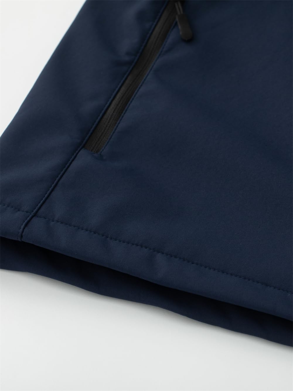KVE softshell in navy pairs with athletic wear for versatile layering.