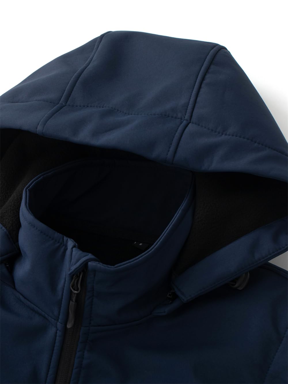 KVE vest shows water-resistant fabric keeping you dry in light rain.