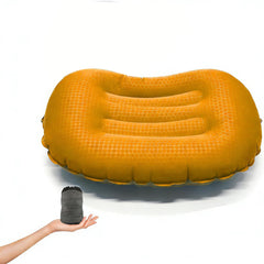 KVNTOOLS Ultralight camping pillow in orange supports neck and lumbar for travel comfort.
