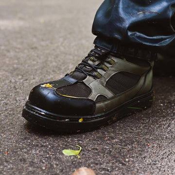 Kylebooker green wading boot shows non-slip sole for stable footing.