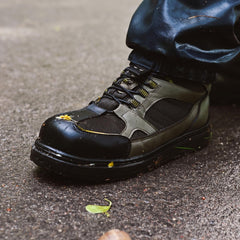 Kylebooker green wading boot shows non-slip sole for stable footing.