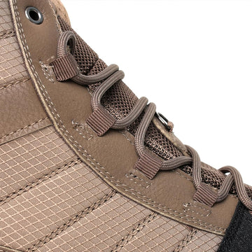 Kylebooker men's wading boots on river rocks demonstrating stability in current