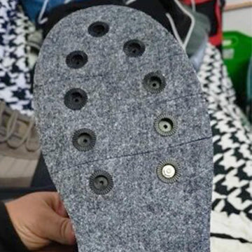 Close-up of screw-in wading boot studs 26-piece set