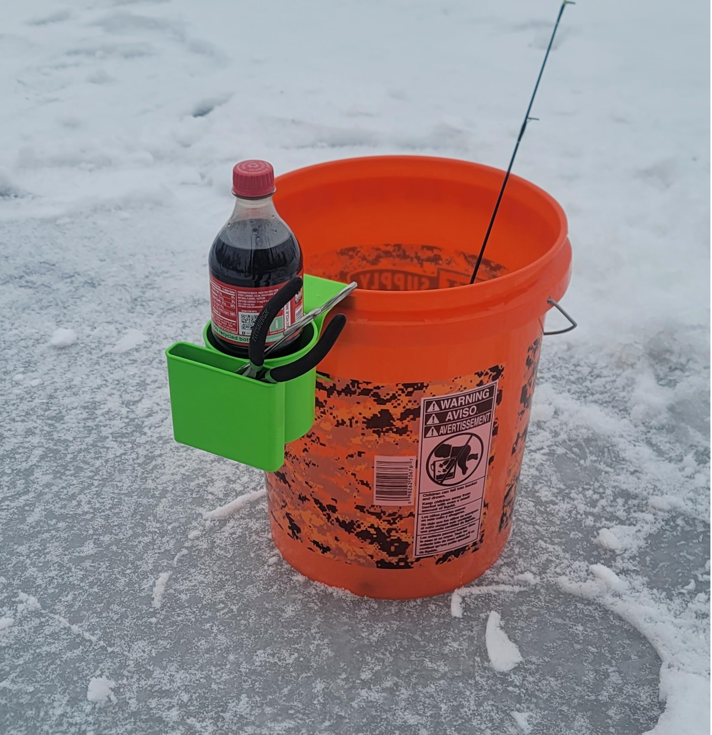 Phone and beverage secured by the holder during ice fishing