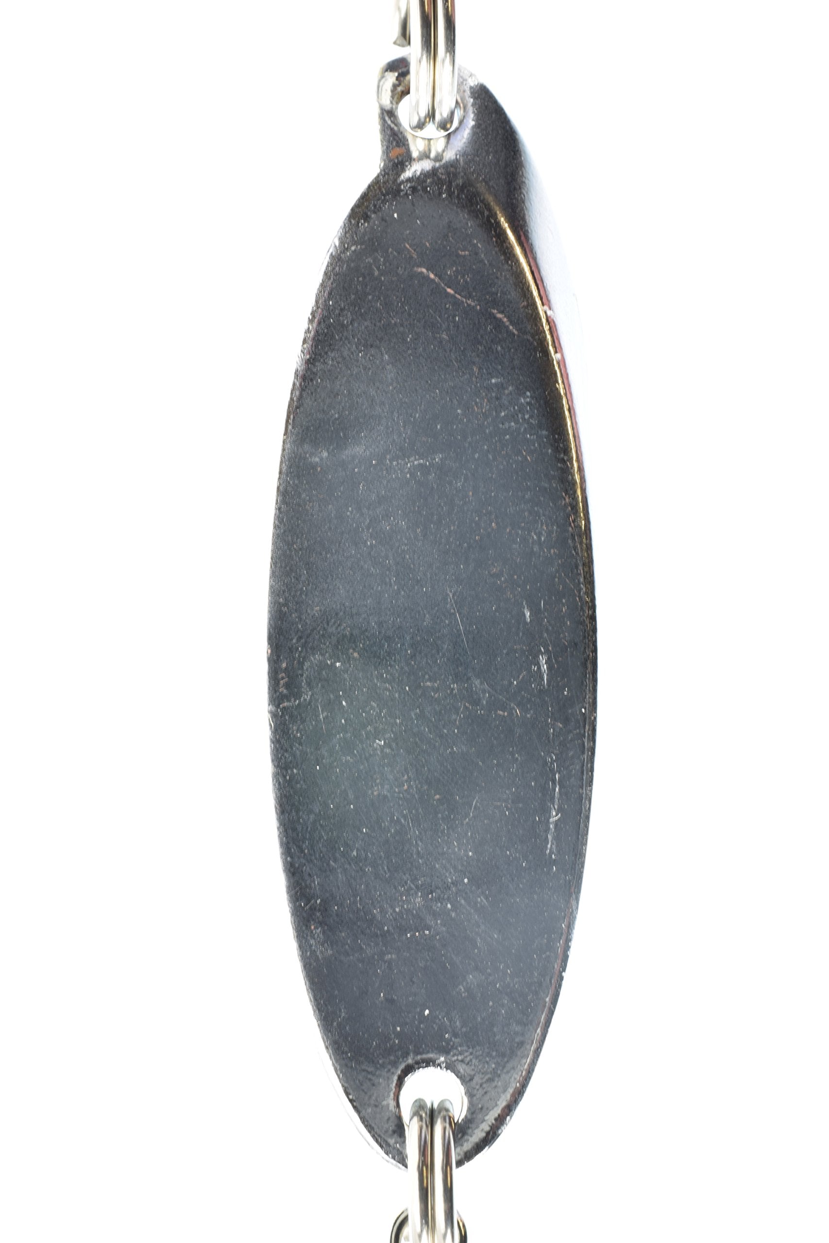 Angler using casting spoon lure in freshwater