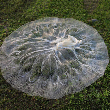 Lawaia cast net in shallow-water setting showcases versatile application.