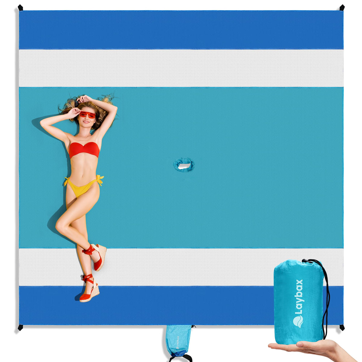 Laybax blue beach blanket with umbrella hole ready for shade and sand protection.