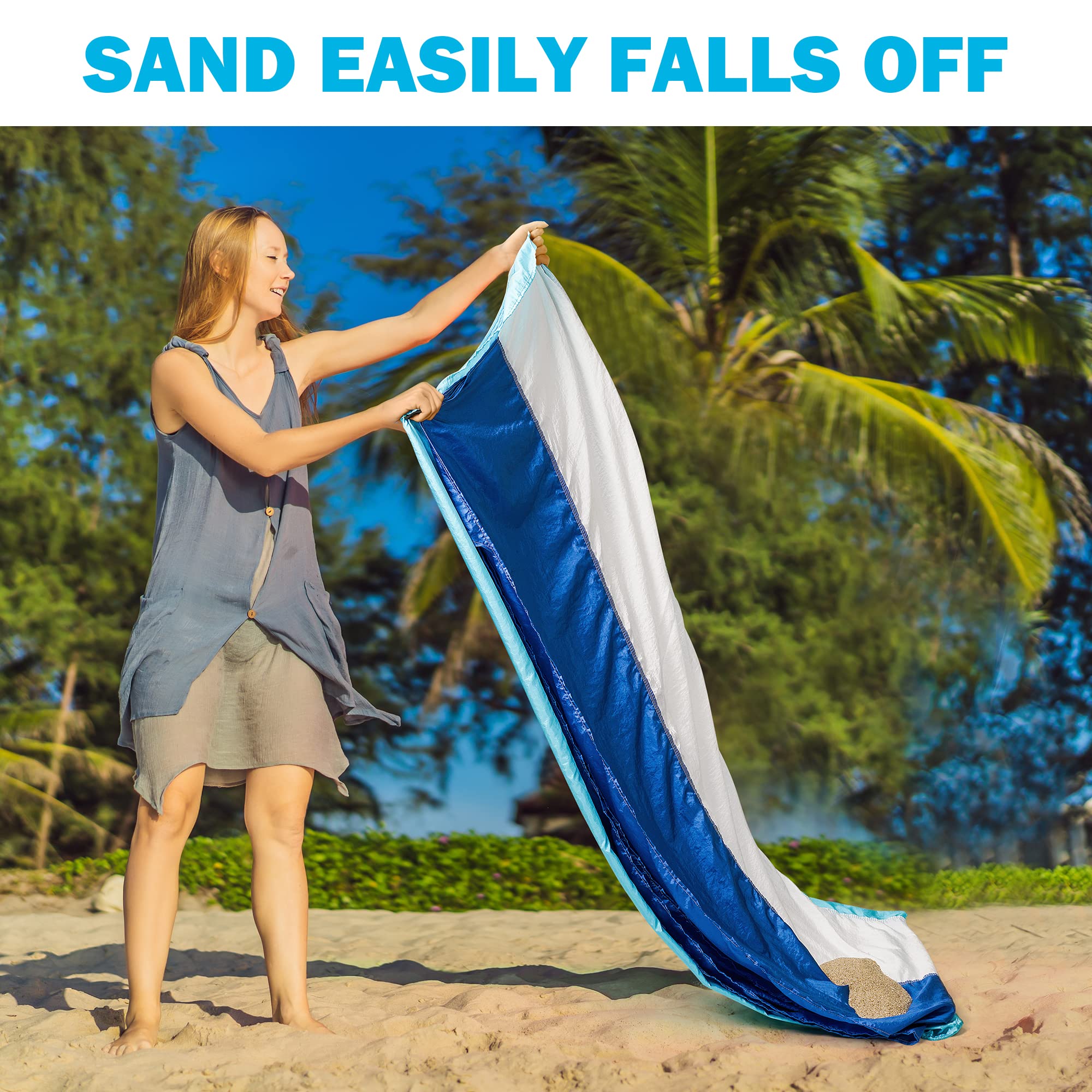 Laybax durable blanket pitched with stakes on windy beach.