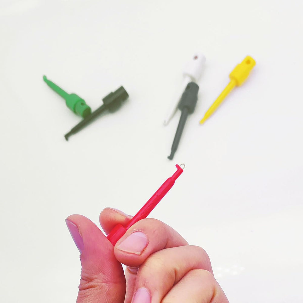 Pliers displaying flies, lures and hooks clearly