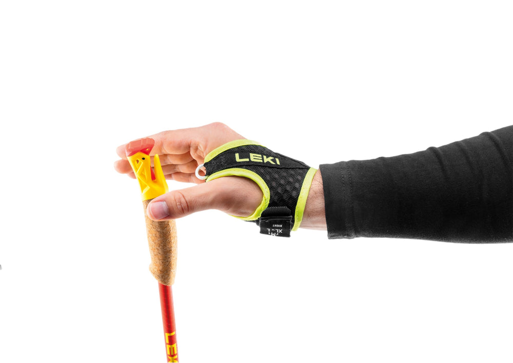 LEKI Ultratrail FX.One red-yellow-carbon colorway stands out on rugged trails