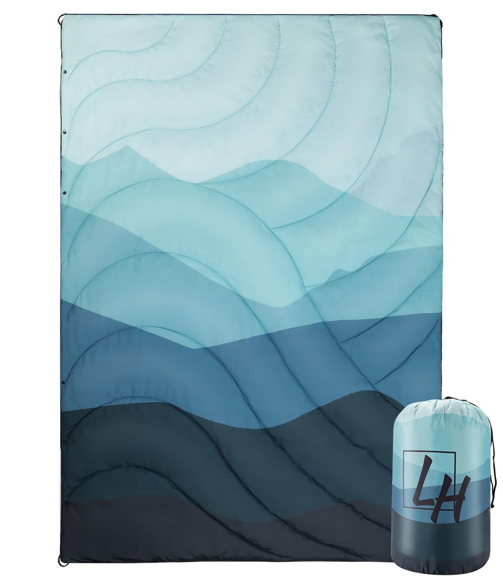 LH Outdoor Puffy Blanket folded in compact bag for easy travel.