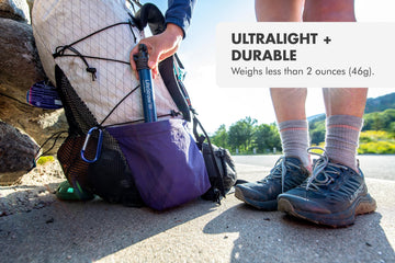 LifeStraw cap and strap packaging scene showing field-ready setup