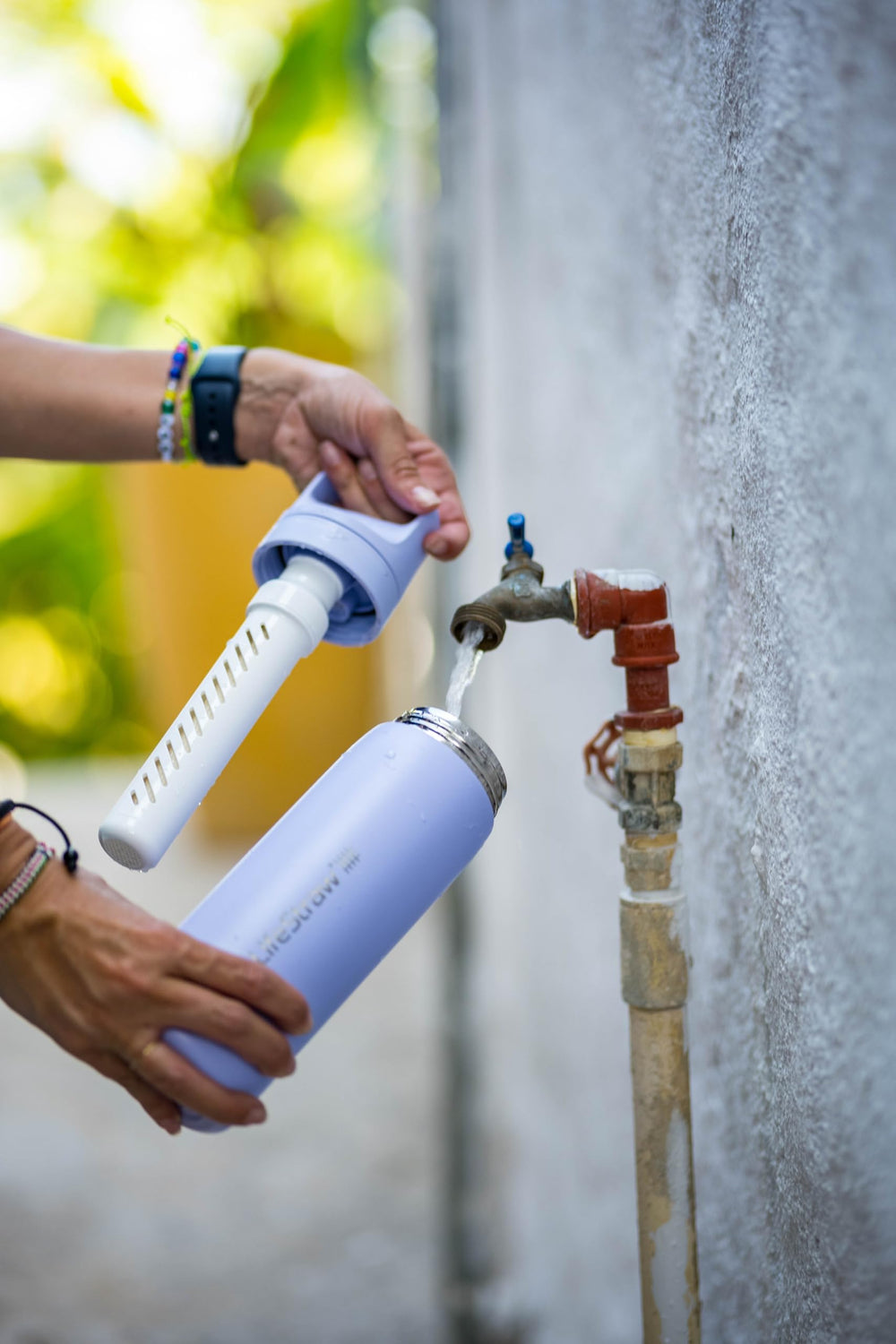 LifeStraw Go Laguna Teal bottle pouring moment, ready for any adventure.