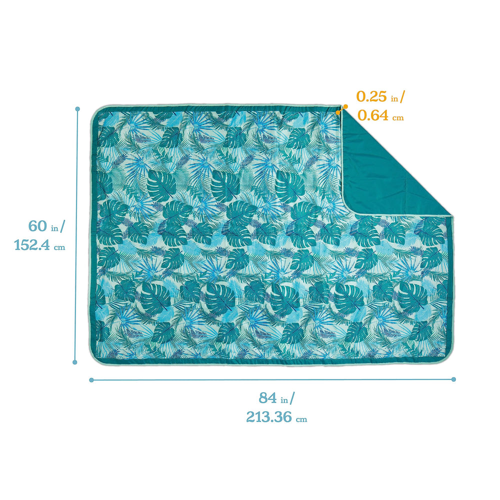 Lightspeed Outdoors XL blanket showing water-resistant base on damp grass
