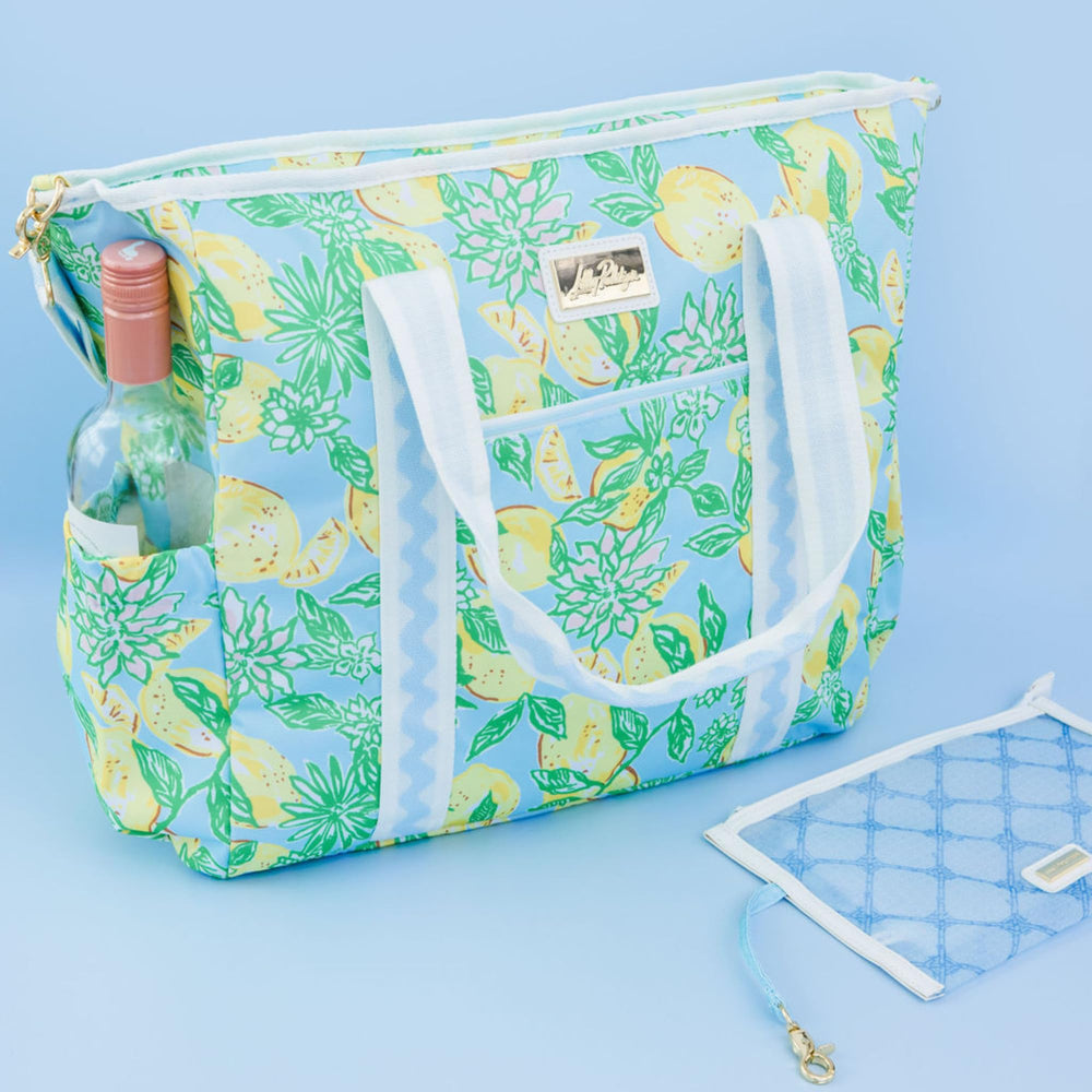 Lilly Pulitzer yellow picnic cooler on picnic setup conveys ready-to-use freshness at gatherings.