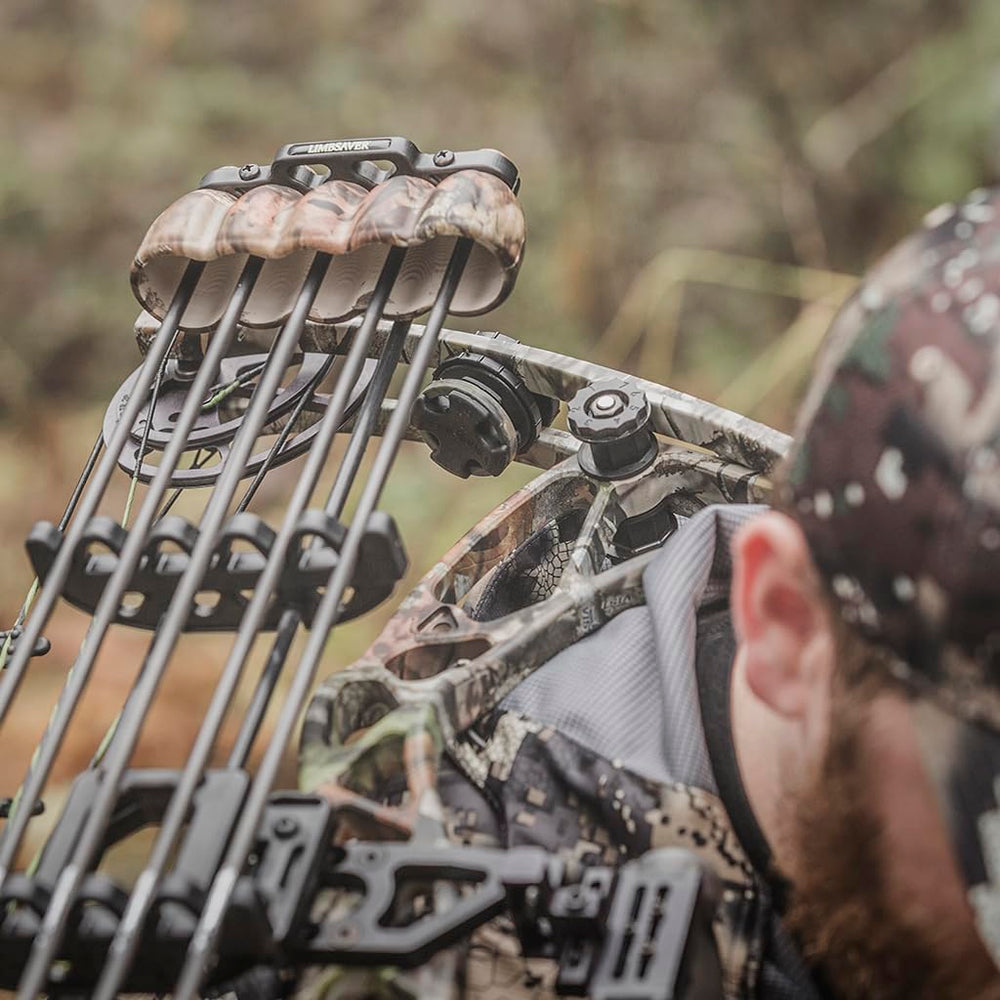 Camouflage bow with dampeners in an outdoor setting