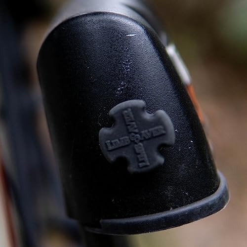 Low-profile Mini UltraQuad dampeners installed on archery accessory
