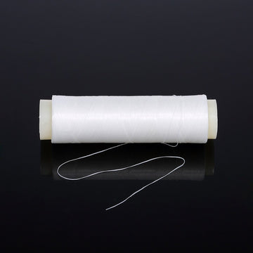 Close-up of elastic bait thread wound on a spool