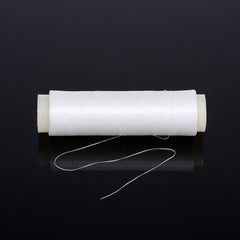 Close-up of elastic bait thread wound on a spool