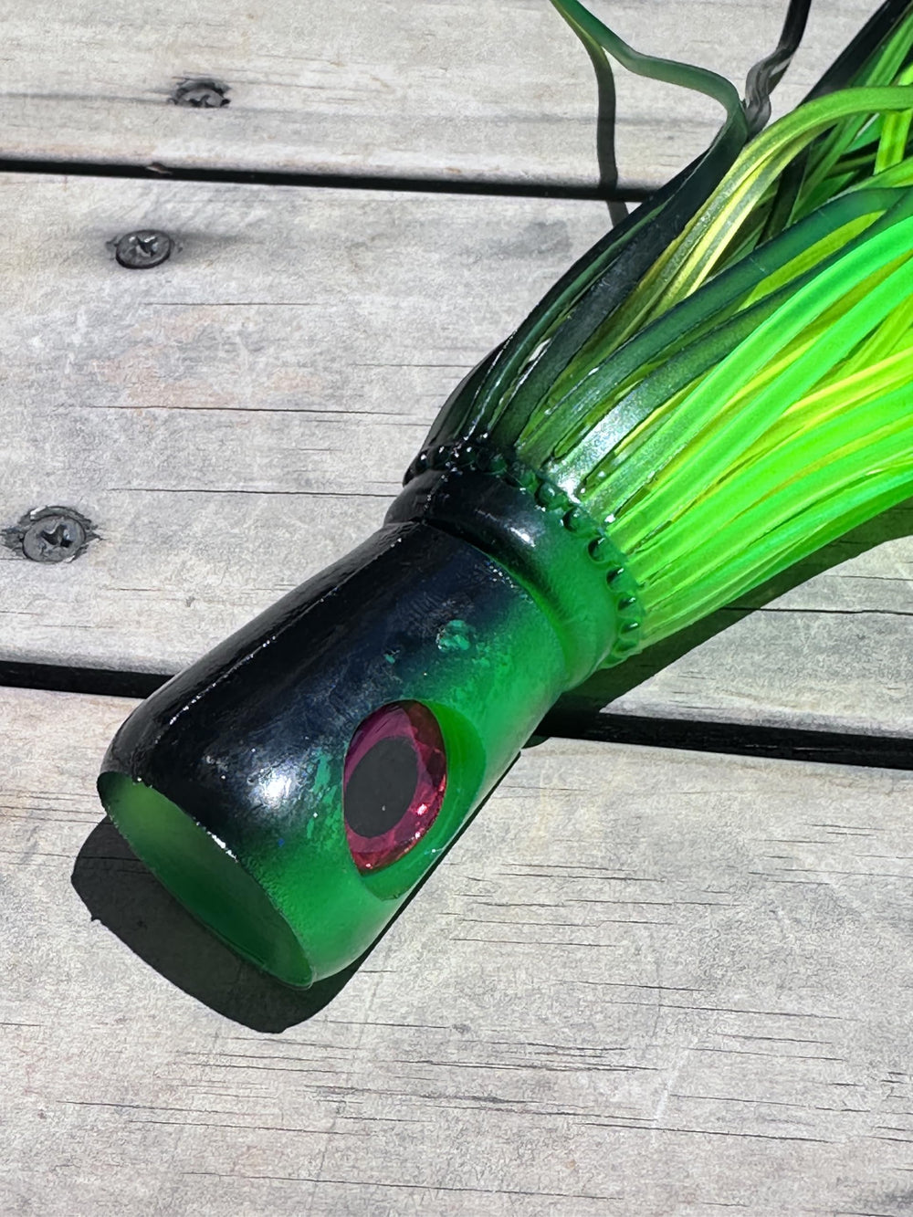 Side view showing double skirts for enhanced wake and visibility in green-black