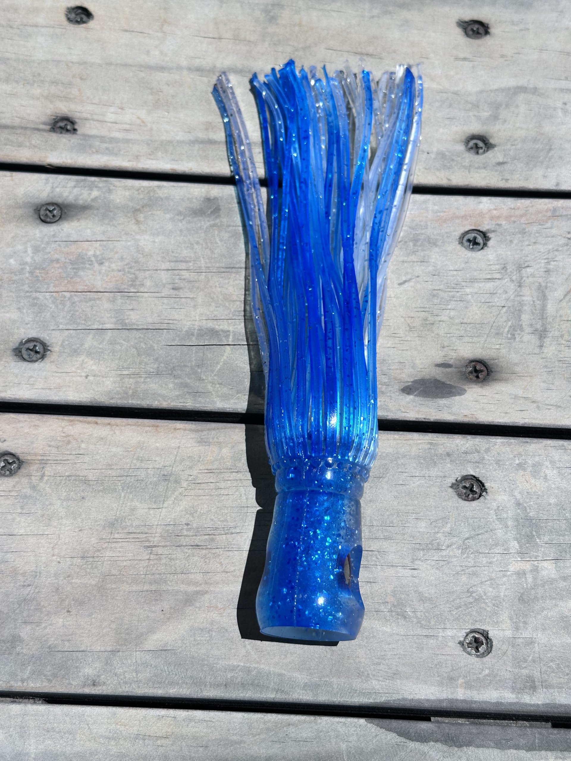 Lobo Lures Big Chugger teaser behind squid chain generates surface bubbles