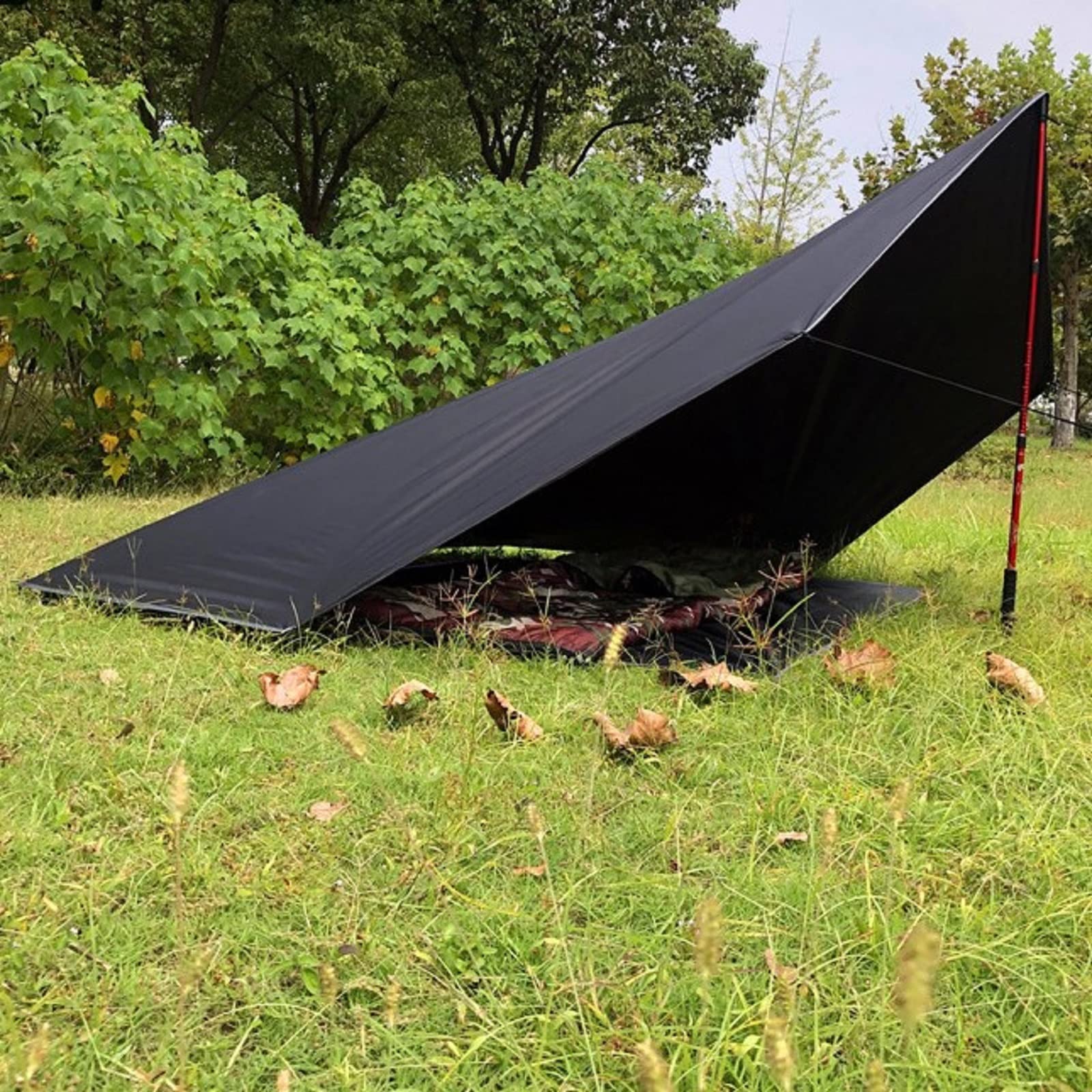 Longeek octagon picnic blanket used to form a simple awning in outdoor space.