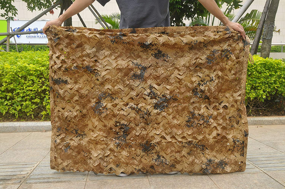LOOGU camo netting used in paintball game field for realistic cover.
