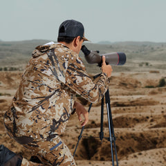 LOOGU men's camo hunting pants water-resistant fabric close-up; reliable damp-weather performance.