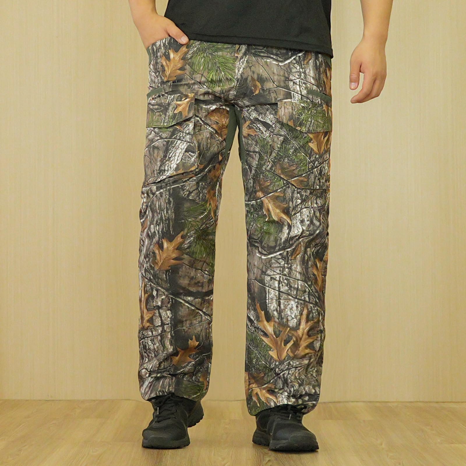 LOOGU camo patterned pants in forest setting enhance concealment for hunting.