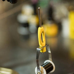 Loon Ergo Bobbin spring-steel-spool-holder enables easy tension adjustment by grip.