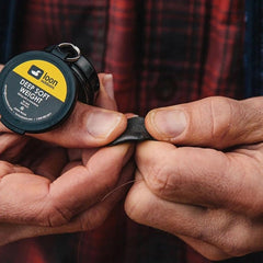 Close-up of adjustable tungsten putty weight and depth control