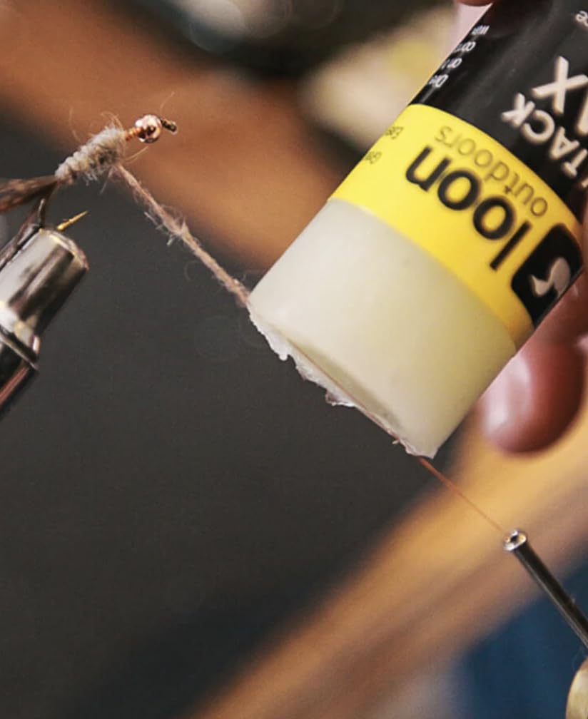 Loon Swax High Tack with push-bottom cap for easy, controlled application.
