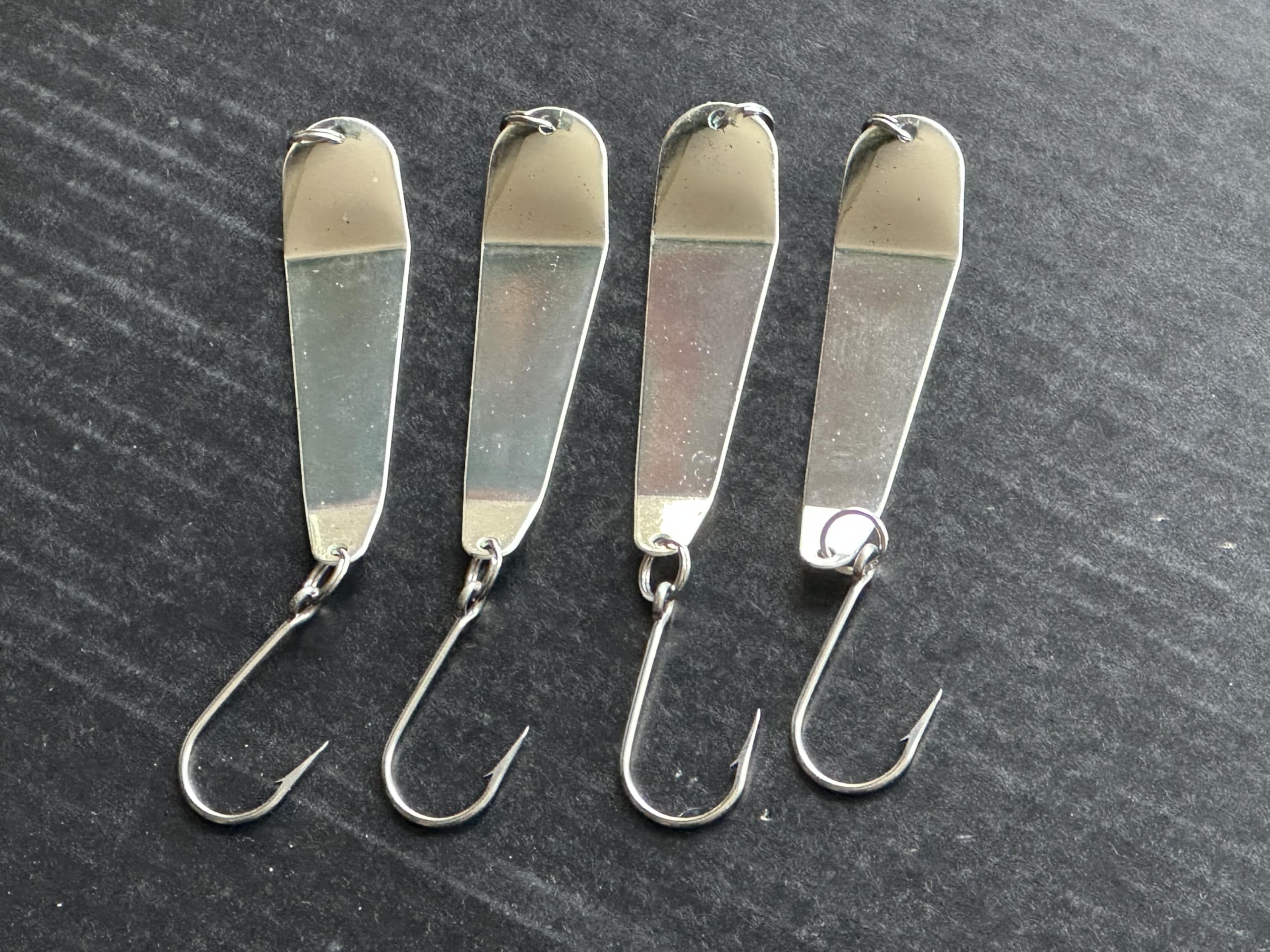 Front view of Loony Spoons lure showing reflective surface and hooks.
