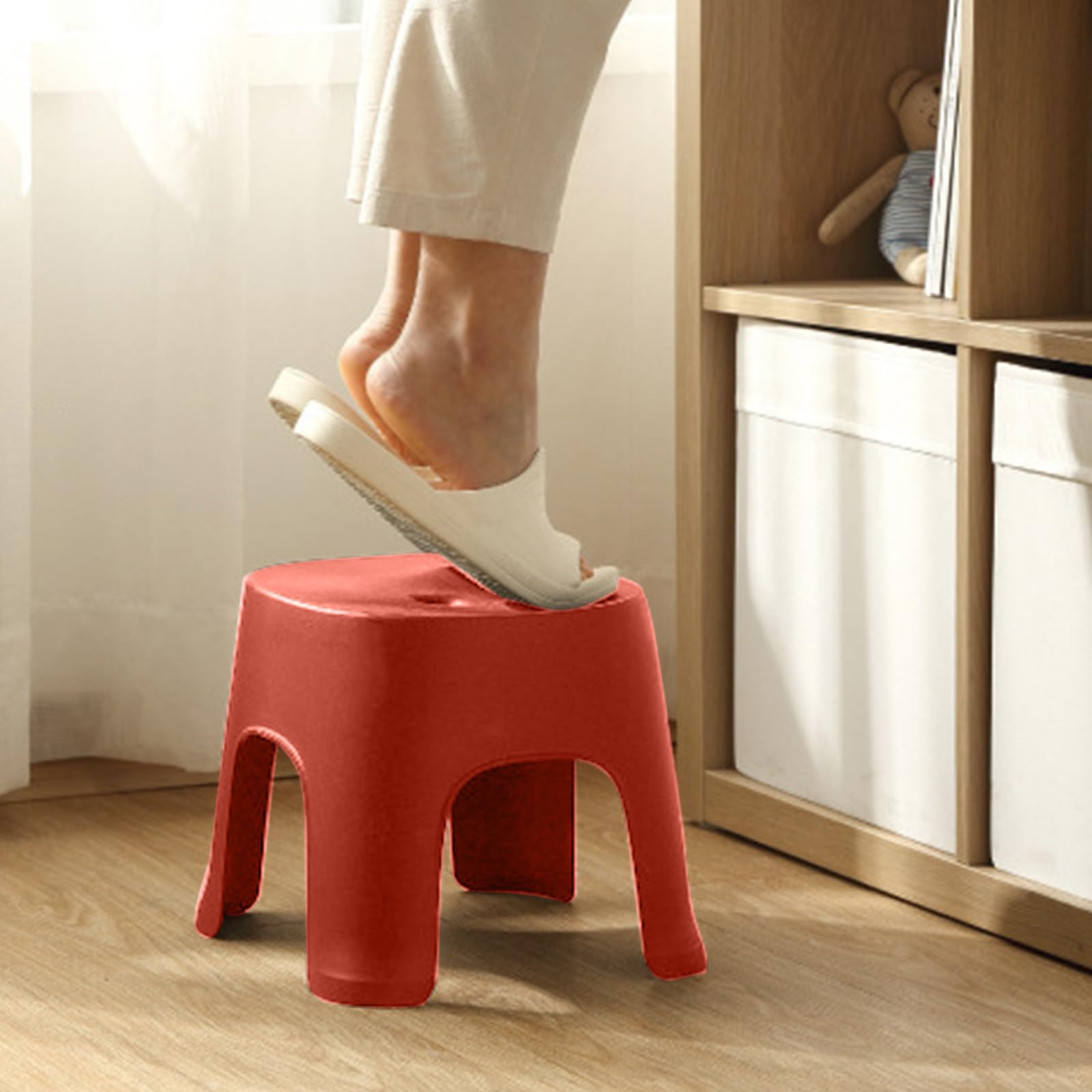 Lovskoo plastic mini stool at entryway for comfortable shoe changing.