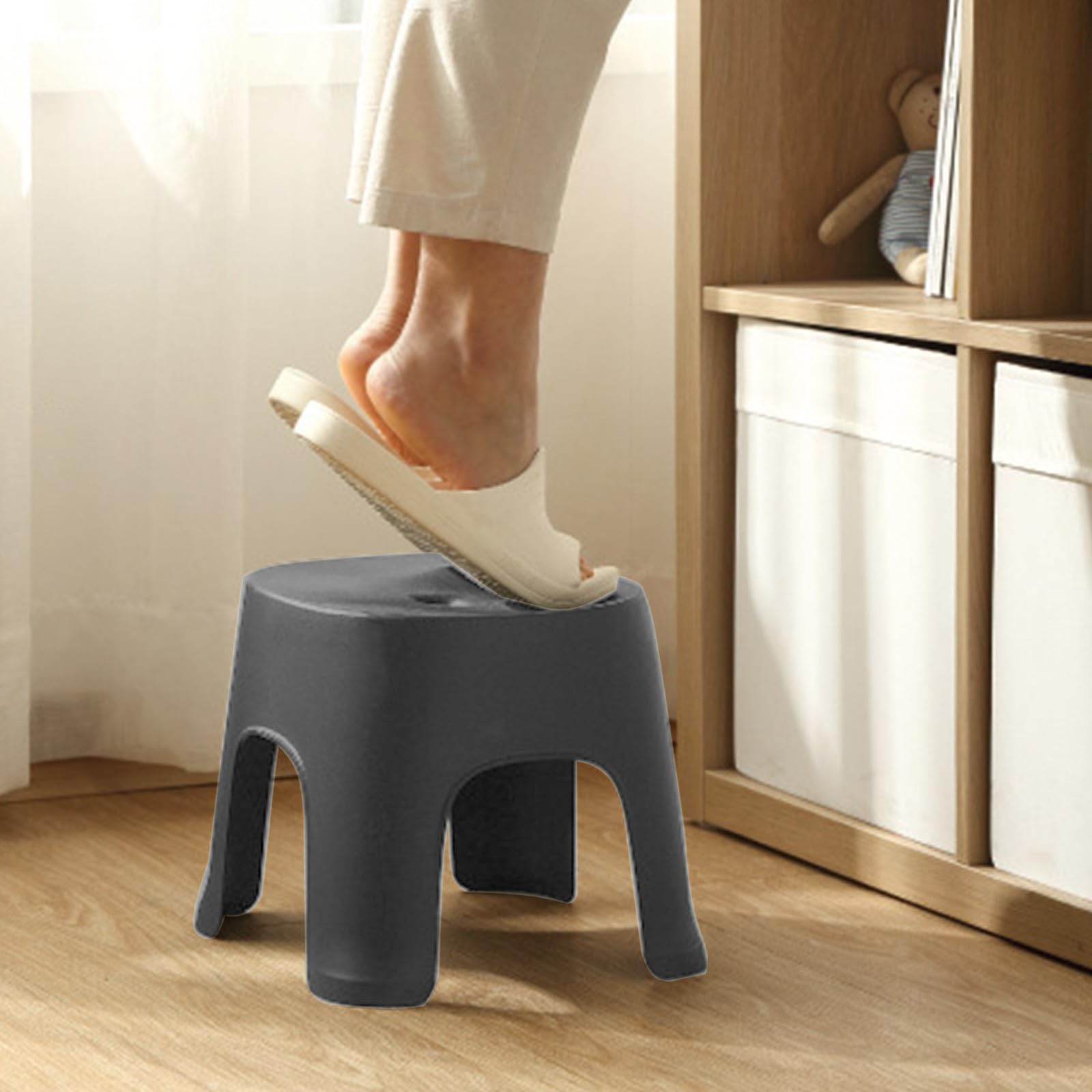 Lovskoo Plastic Mini Stool being moved, lightweight and portable for home use.