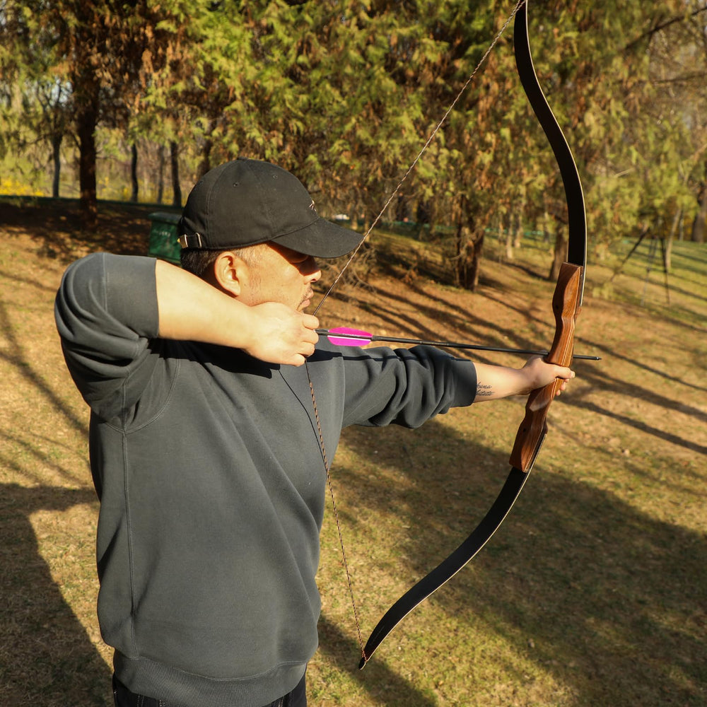 LWANO D97 in action during outdoor archery for stability and reduced vibration.